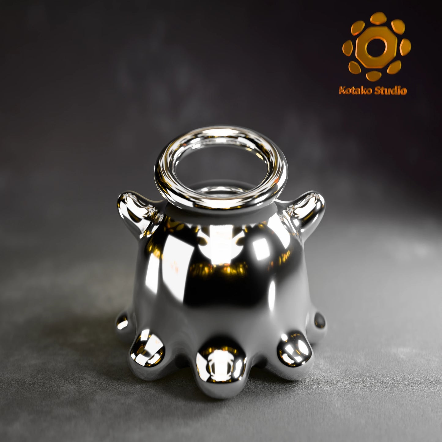 Polished sterling silver Takodachi charm, mascot of Hololive's Ninomae Ina'nis, shown from a back view.