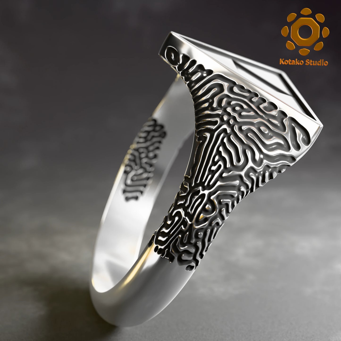 Sterling silver Zelda Triforce ring with an Ancient Shrine pattern inspired by Breath of the Wild. Angled side view.