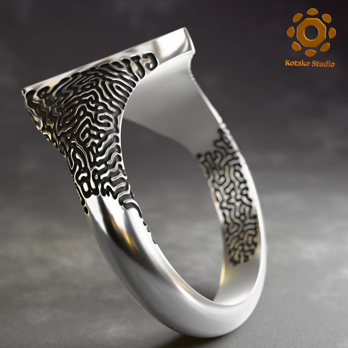 Sterling silver Zelda Triforce ring with an Ancient Shrine pattern inspired by Breath of the Wild. Angled back view.