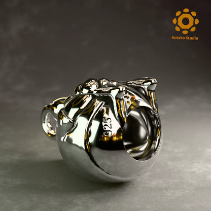 Polished sterling silver KFP Chicken pendant holding a quaso, inspired by Hololive's Takanashi Kiara. Laying on it's back showing the hole on it's bottom.