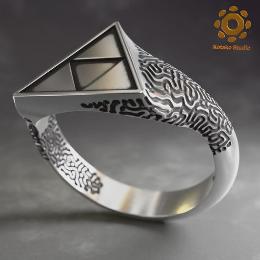 Video of the Sterling silver Zelda Triforce ring with an Ancient Shrine pattern inspired by Breath of the Wild. Rotating on it's own axis to showcase it's form.